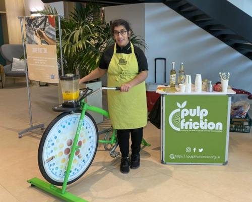 Simran with the smoothie bike at an event