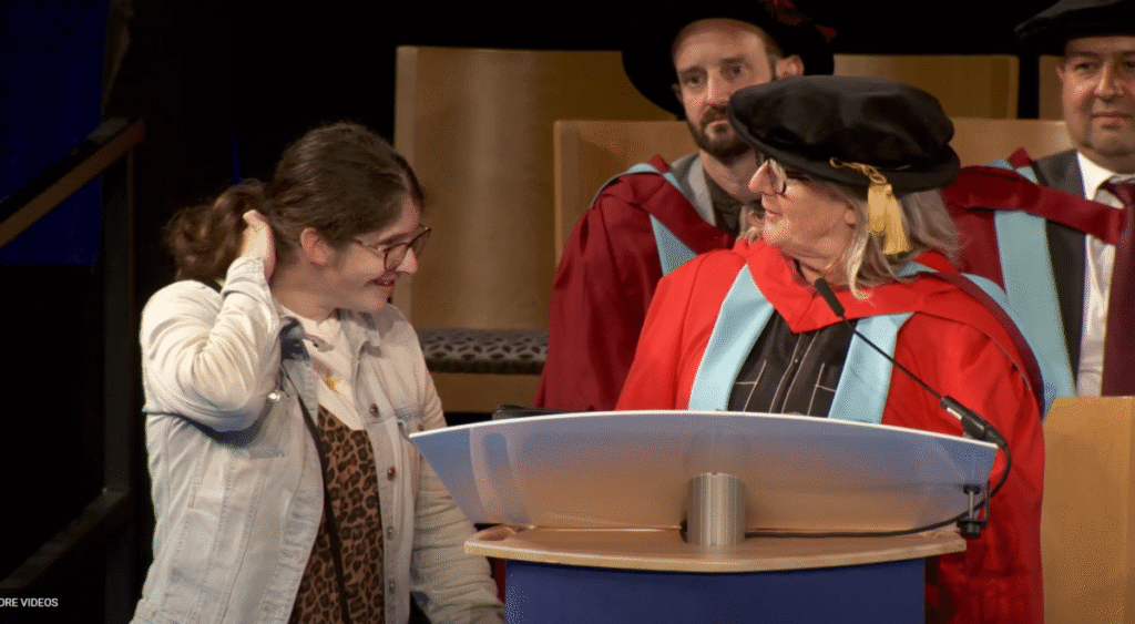 Jill and Jessie speaking on stage at the University of Nottingham graduation ceremony