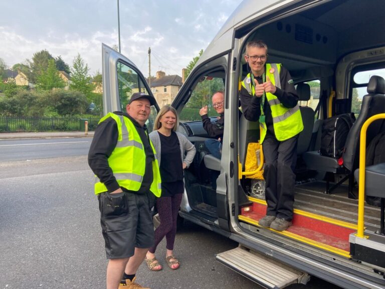 Volunteer driver stood near vehicle with pulp friction members